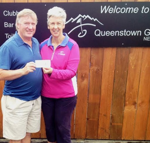 Heather Atkinson from The First Tee Wakatipu presenting NZ Open season pass to John Frampton.